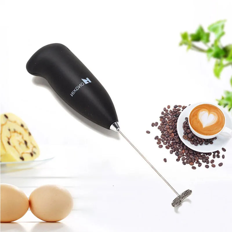 Handheld electric milk frother for whisking and mixing drinks, ideal for coffee and kitchen tasks