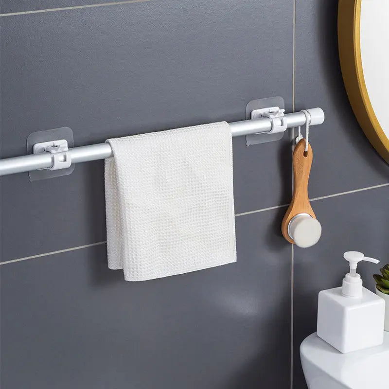 Self-adhesive hooks for hanging curtain rods without punching holes. Ideal for securing shower curtains and other household items