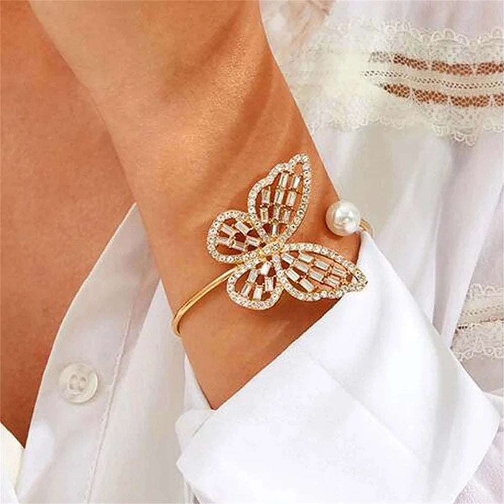 Elegant butterfly bracelet with hollow zircon, pearl, and crystal pendant. Adjustable bangle for women's hand jewelry gift