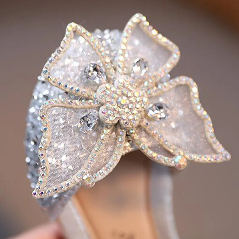 Summer girls' sandals with sequins, rhinestone bow, and flat heel. Available in sizes 21-35