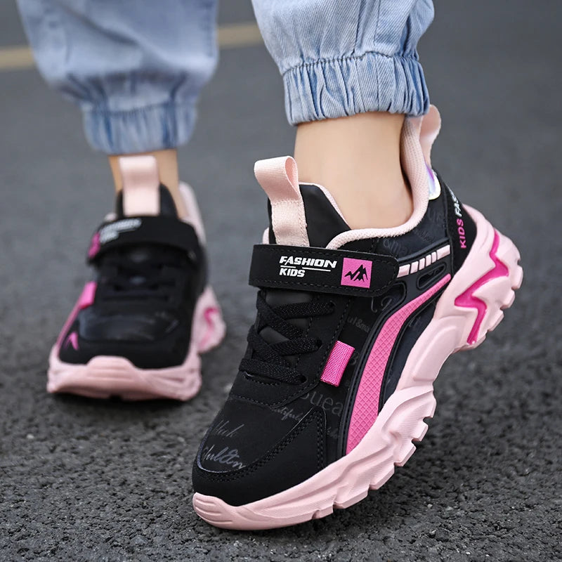 Pink leather girls' sneakers for casual wear. Comfortable and breathable, suitable for running and sports activities