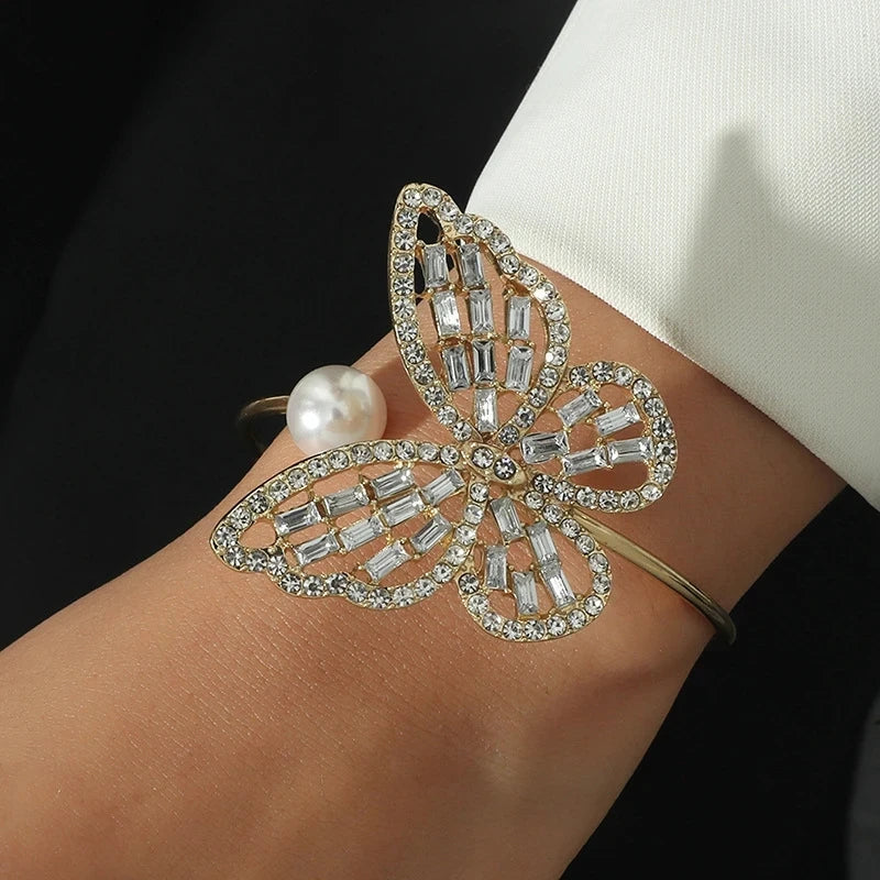 Elegant butterfly bracelet with hollow zircon, pearl, and crystal pendant. Adjustable bangle for women's hand jewelry gift